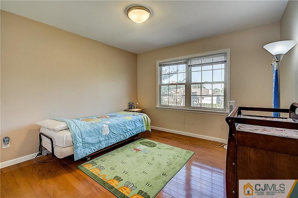 35 Williams Road Edison, NJ 08820 - Photo 39 of 47 a bedroom with a bed and a window