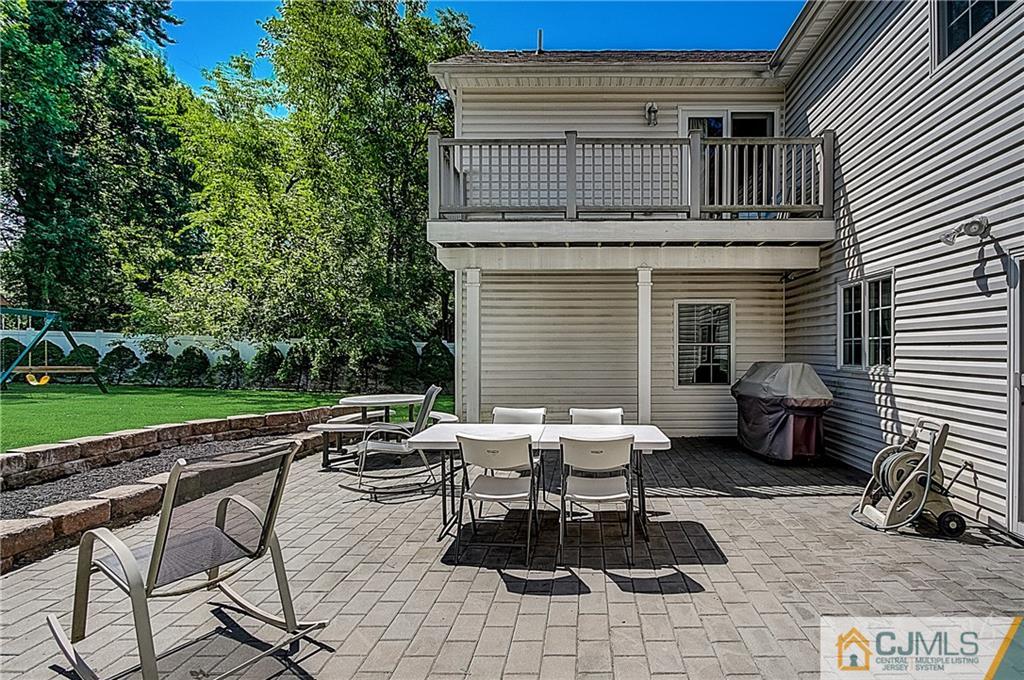35 Williams Road Edison, NJ 08820 - Photo 44 of 47 a roof deck with table and chairs and potted plants