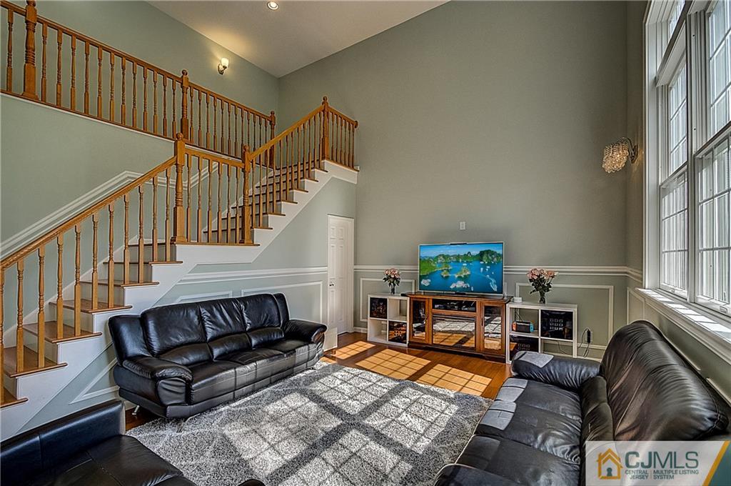 35 Williams Road Edison, NJ 08820 - Photo 6 of 47 a living room with furniture fireplace and a rug