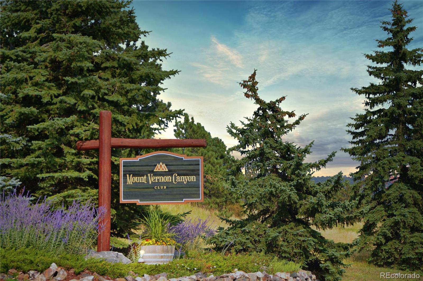 Lot 3 Ridge Way Golden, CO 80401 - Photo 4 of 18 a sign that is sitting in front of flowers