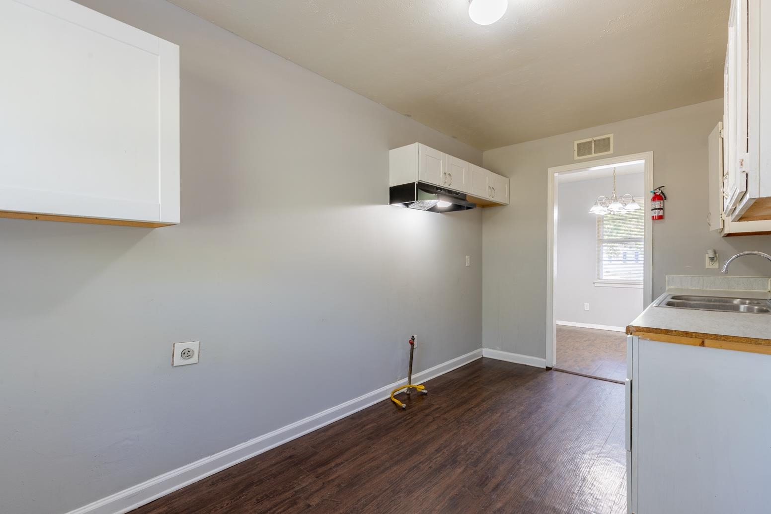5581 Lochinvar Road Memphis, TN 38116 - Photo 12 of 19 a room with wooden floor and a window