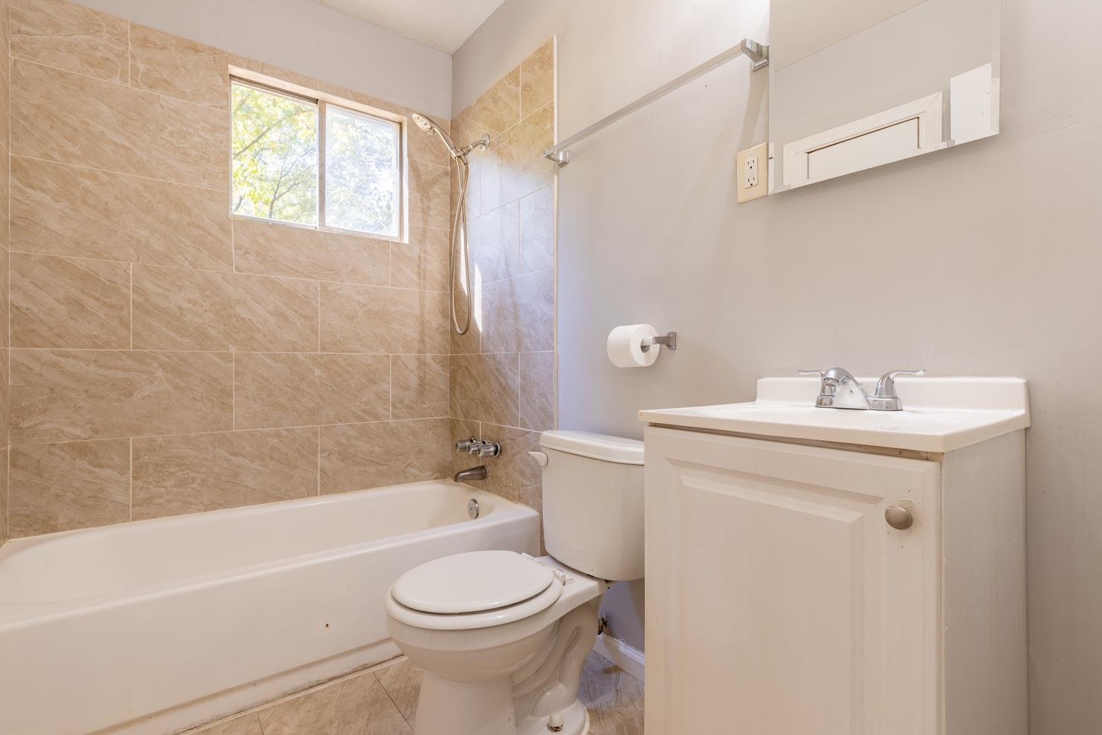 5581 Lochinvar Road Memphis, TN 38116 - Photo 15 of 19 a bathroom with a sink a toilet and shower
