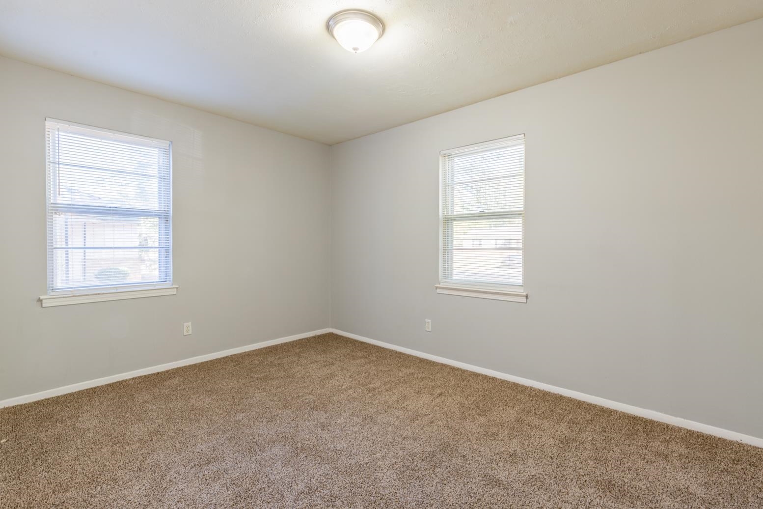 5581 Lochinvar Road Memphis, TN 38116 - Photo 16 of 19 an empty room with windows