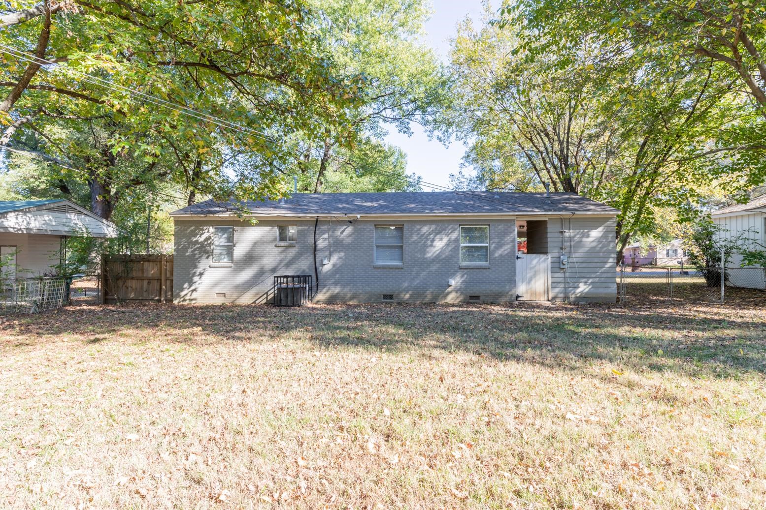 5581 Lochinvar Road Memphis, TN 38116 - Photo 18 of 19 a view of a house with a yard
