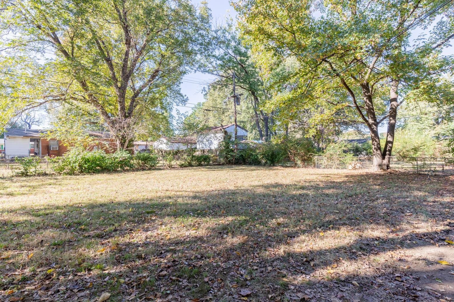 5581 Lochinvar Road Memphis, TN 38116 - Photo 19 of 19 a view of dirt yard with a large tree
