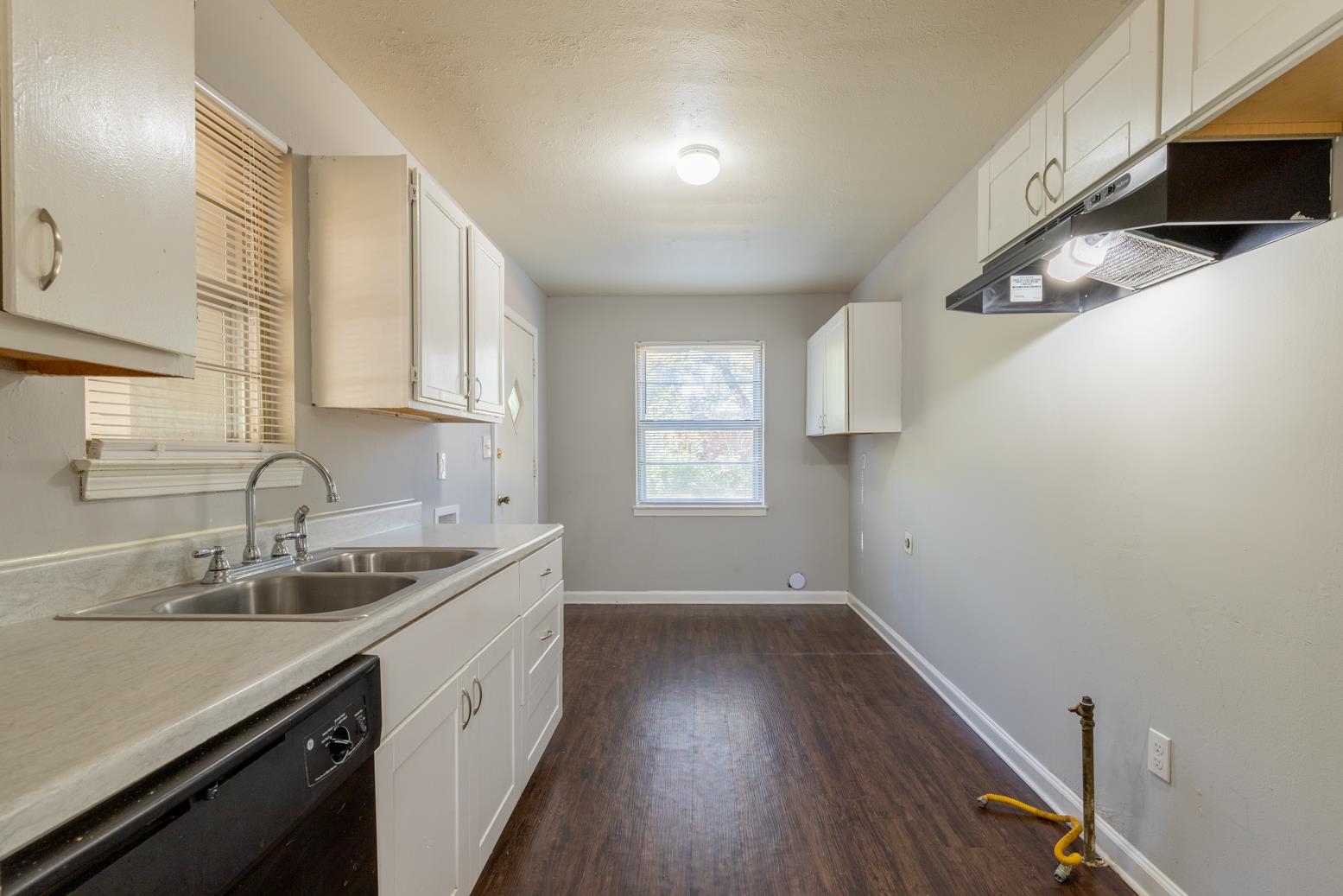 5581 Lochinvar Road Memphis, TN 38116 - Photo 9 of 19 a kitchen with a sink cabinets and window