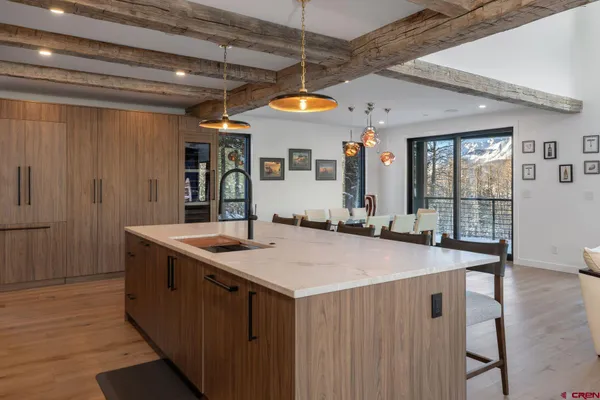 a kitchen with stainless steel appliances granite countertop a sink and cabinets