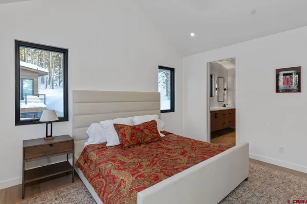 a bedroom with bed and window