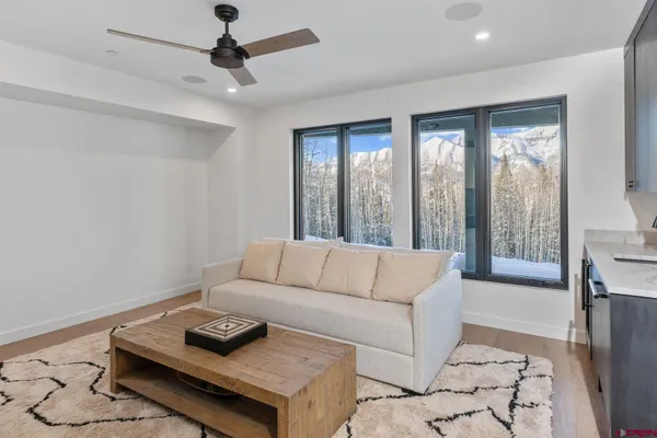 a living room with furniture and a window