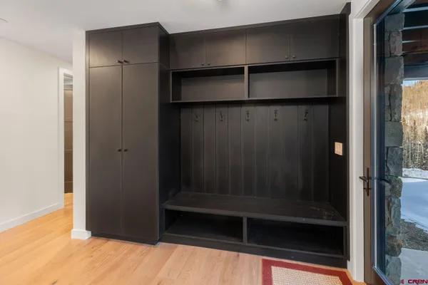 a bathroom with a glass shower door