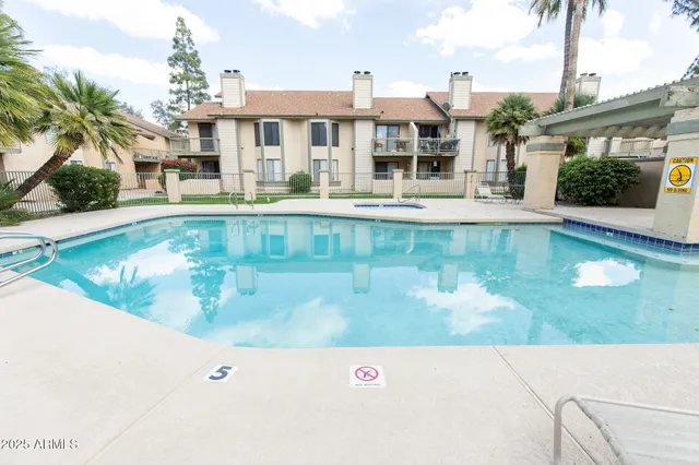 a view of swimming pool with a yard