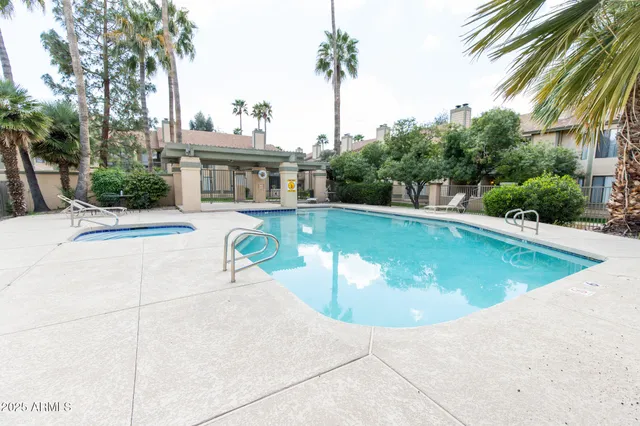 a view of a swimming pool with a patio