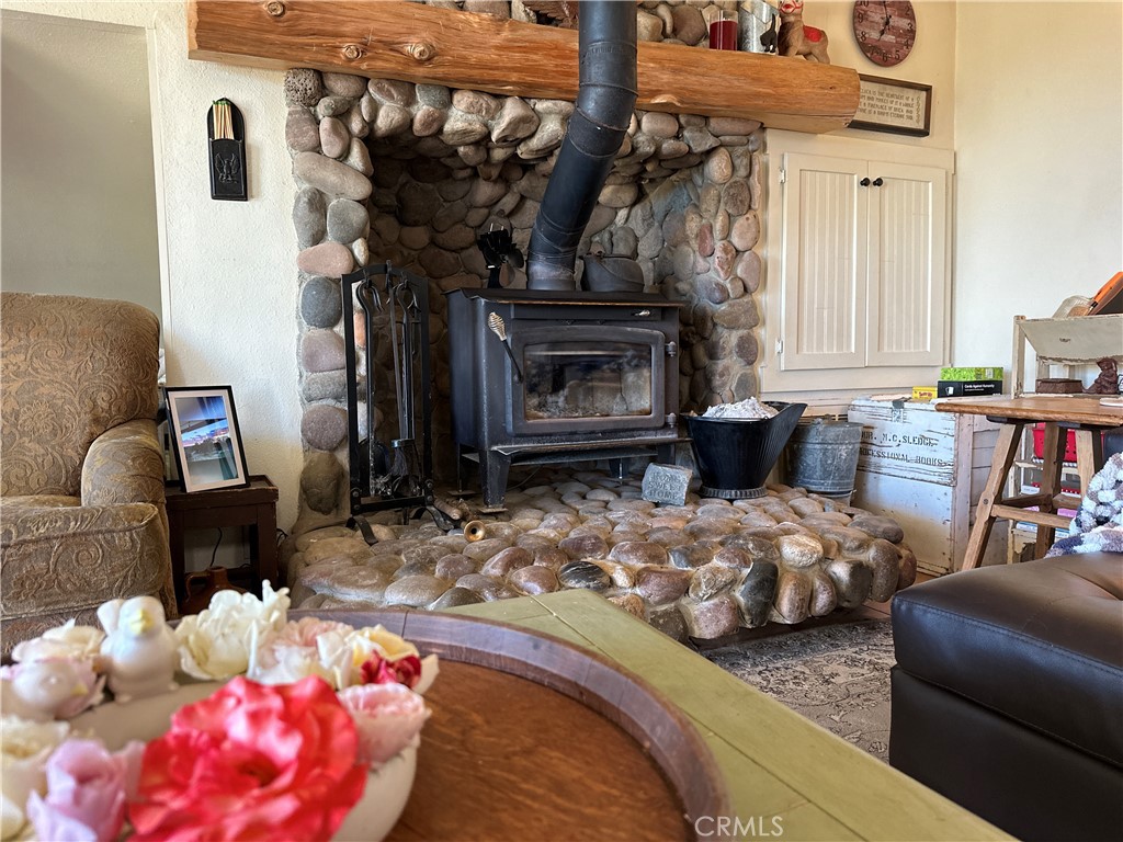 29820 Chihuahua Valley Road Warner Springs, CA 92086 - Photo 33 of 75 a bedroom with furniture and a fireplace