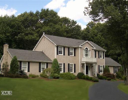 108 Purdy Hill Road Monroe, CT 06468 - Photo 1 of 1 a front view of a house with a garden