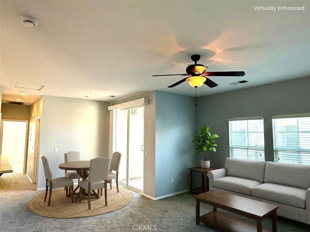 36368 Grazia Way Winchester, CA 92596 - Photo 13 of 27 a living room with furniture and flowers