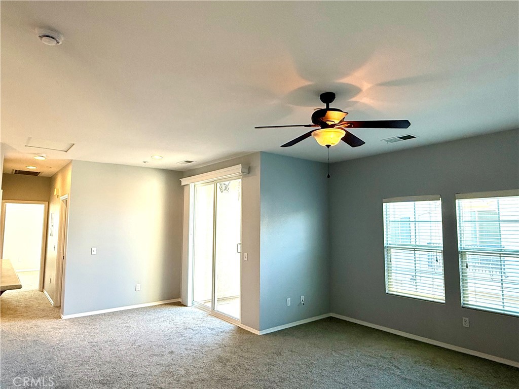 36368 Grazia Way Winchester, CA 92596 - Photo 14 of 27 wooden floor in an empty room with a window