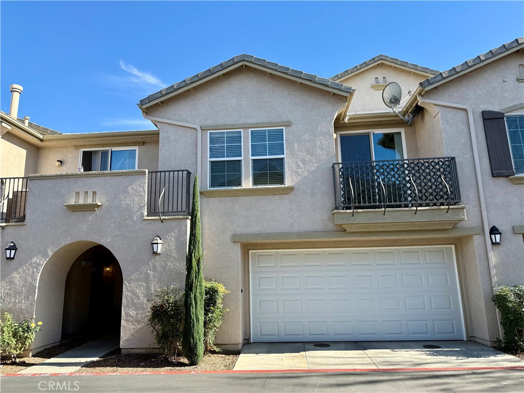 36368 Grazia Way Winchester, CA 92596 - Photo 2 of 27 a front view of a house with garage