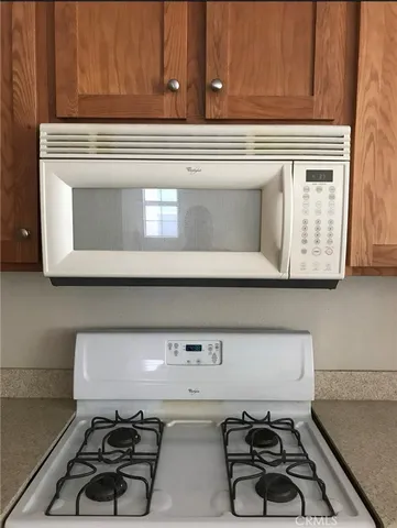 a utility room with sink dryer and washer