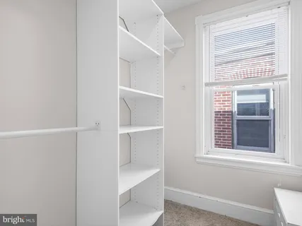 a view of a room that has a window in it