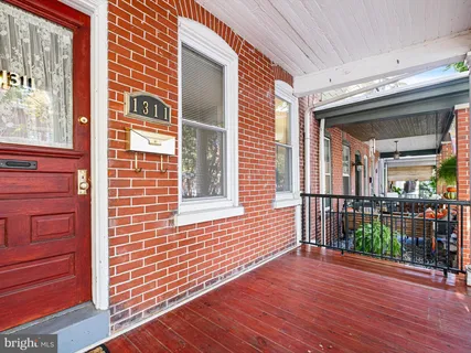 a view of a brick house with a large window