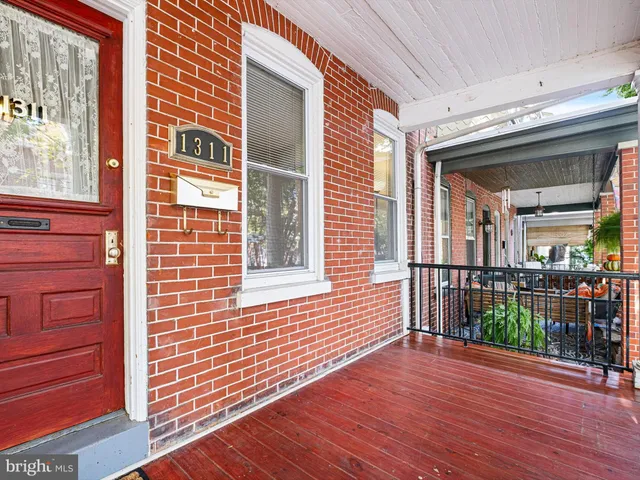 a view of a brick house with a large window