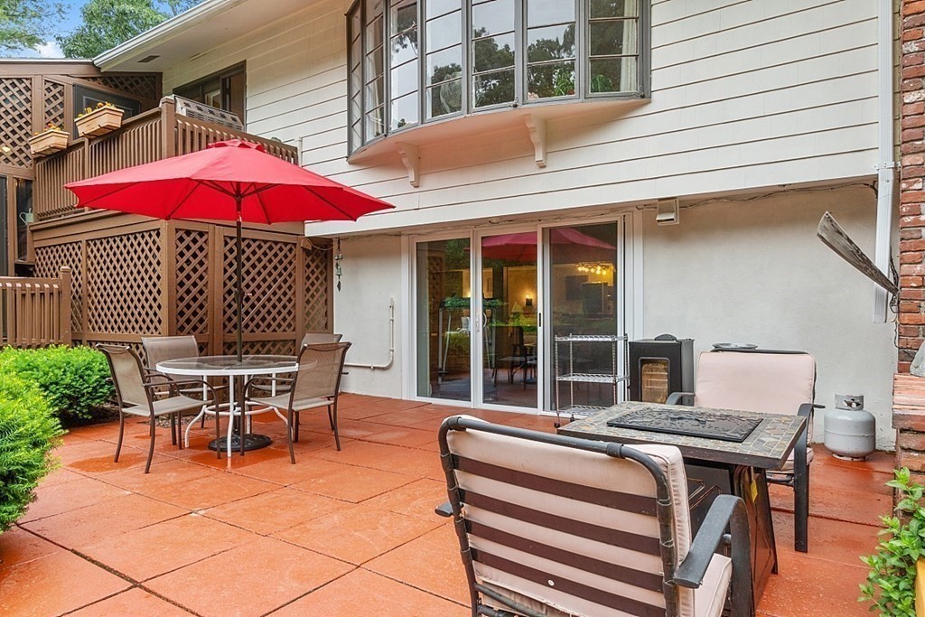 12 Sheridan Road Andover, MA 01810 - Photo 13 of 40 a patio with a table and chairs