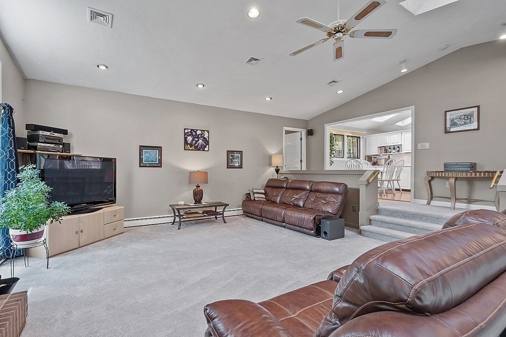 12 Sheridan Road Andover, MA 01810 - Photo 20 of 40 a living room with furniture and a flat screen tv