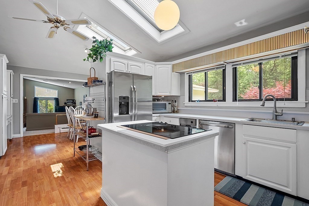 12 Sheridan Road Andover, MA 01810 - Photo 25 of 40 a kitchen that has a sink and a stove in it