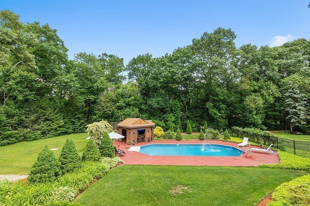 12 Sheridan Road Andover, MA 01810 - Photo 7 of 40 a view of a yard with swimming pool and green space