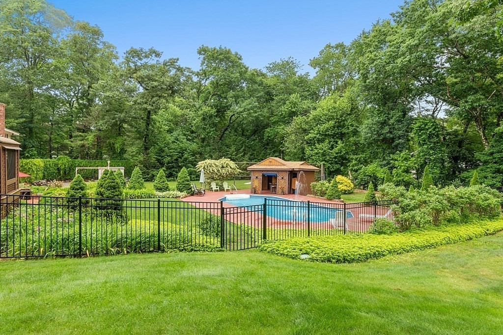 12 Sheridan Road Andover, MA 01810 - Photo 9 of 40 a view of a backyard with a garden and entertaining space