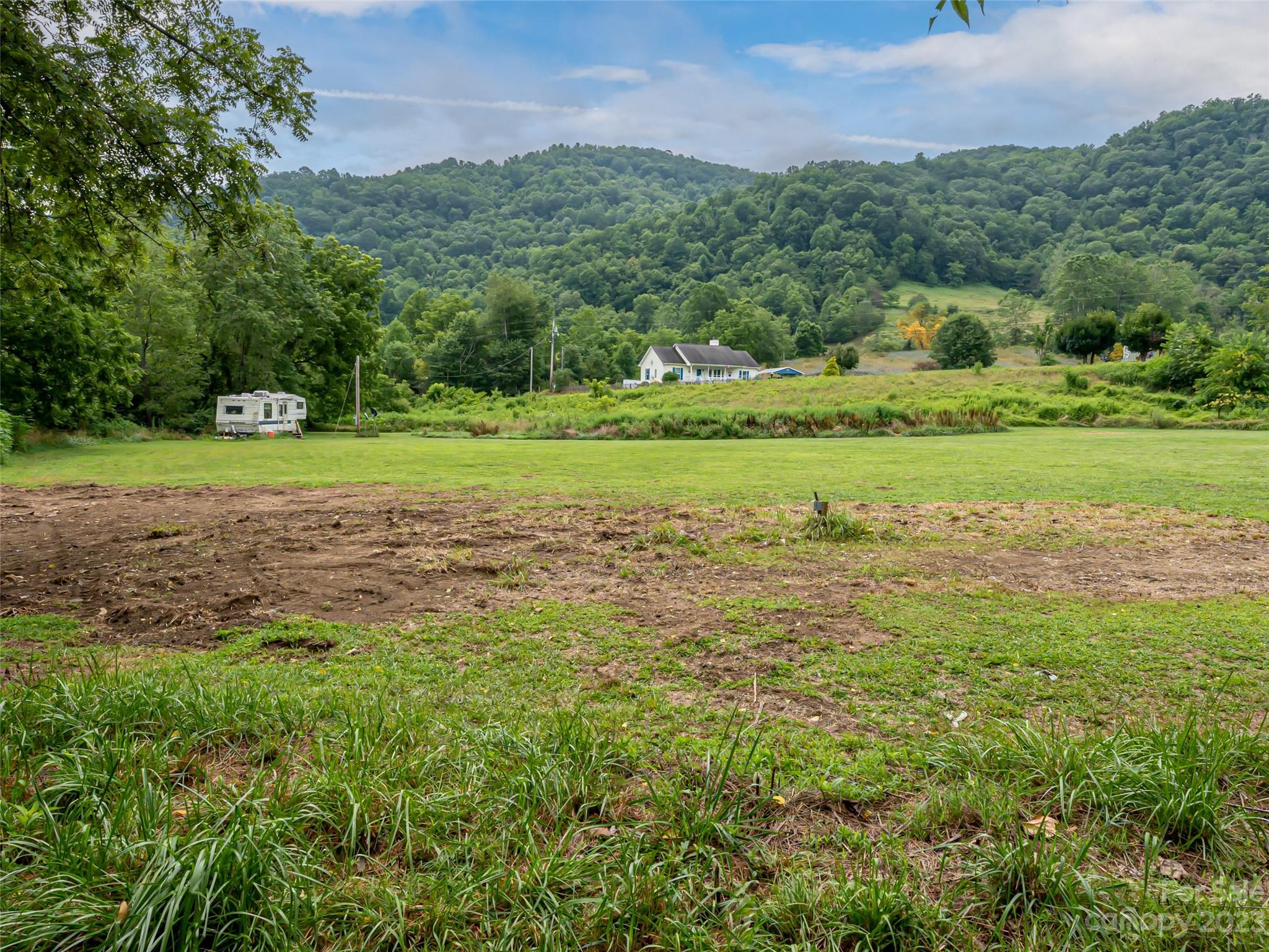 309 Sugar Creek Road Leicester, NC 28748 - Photo 12 of 23 a view of a golf course with a lake