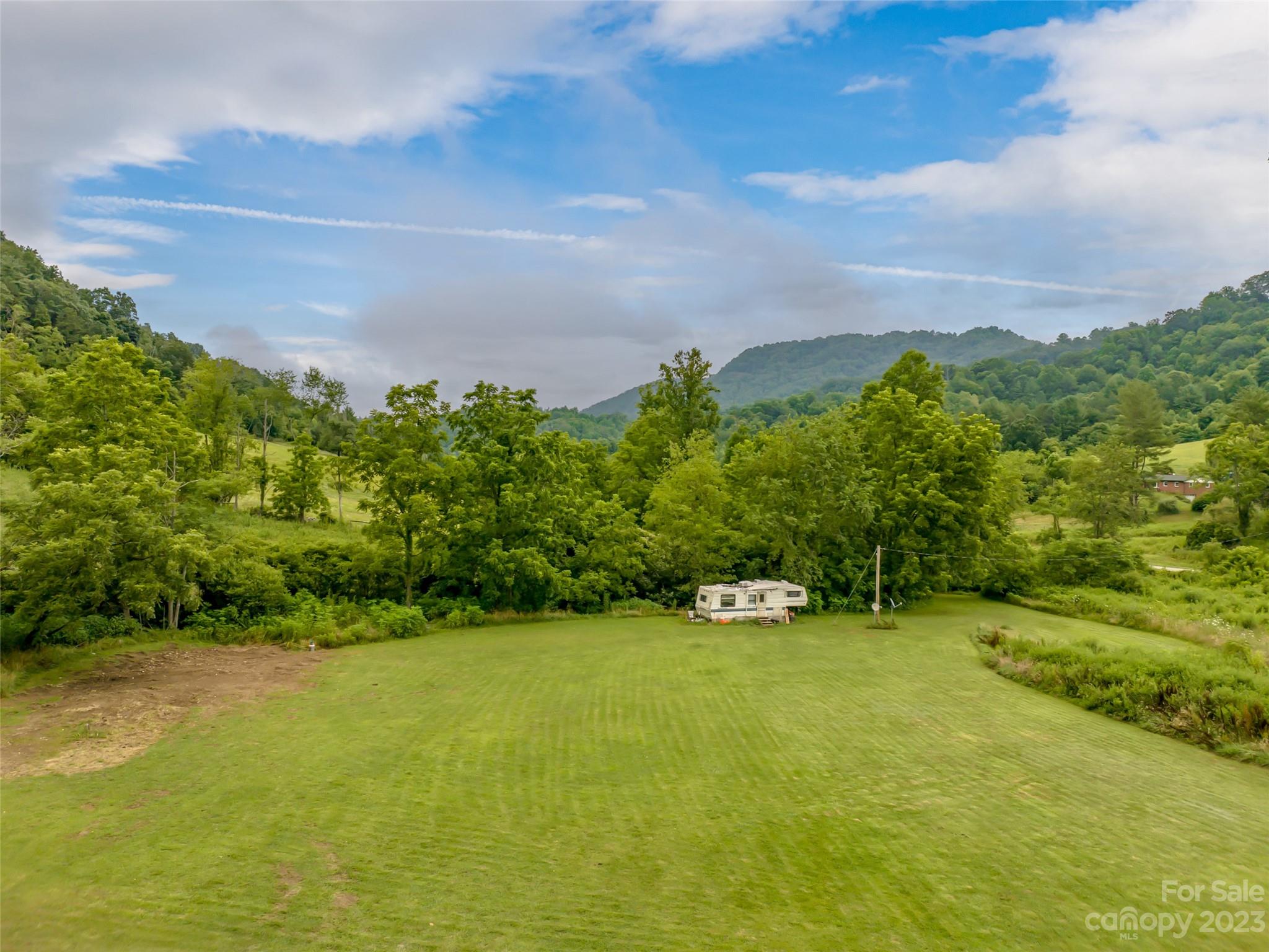 309 Sugar Creek Road Leicester, NC 28748 - Photo 9 of 23 a view of an outdoor space with a lake view