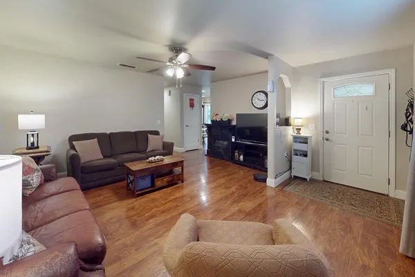 a living room with furniture and a table