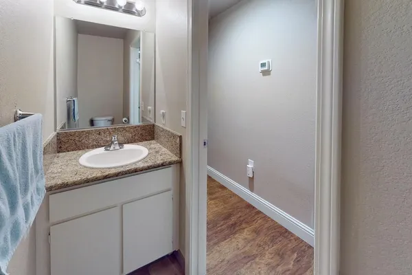 a bathroom with a sink and a mirror