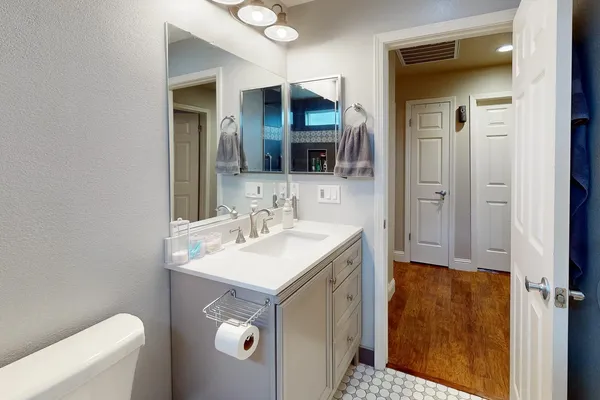 a bathroom with a sink and a mirror