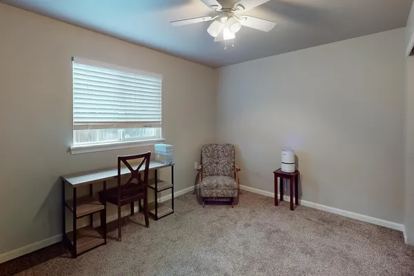 a view of work space with furniture and a window