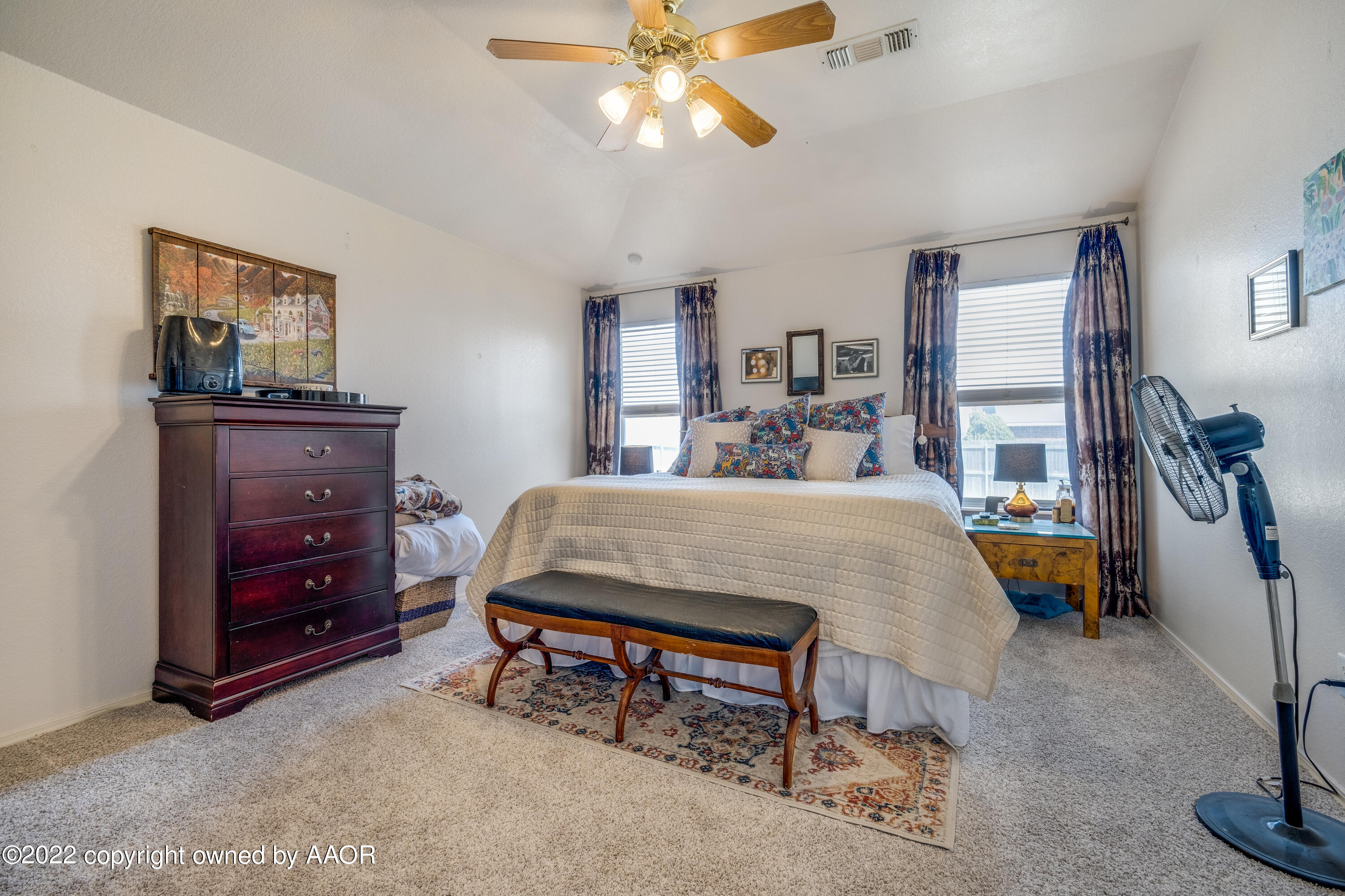 5001 Capulin Lane Amarillo, TX 79110 - Photo 12 of 22 a bedroom with a bed and furniture