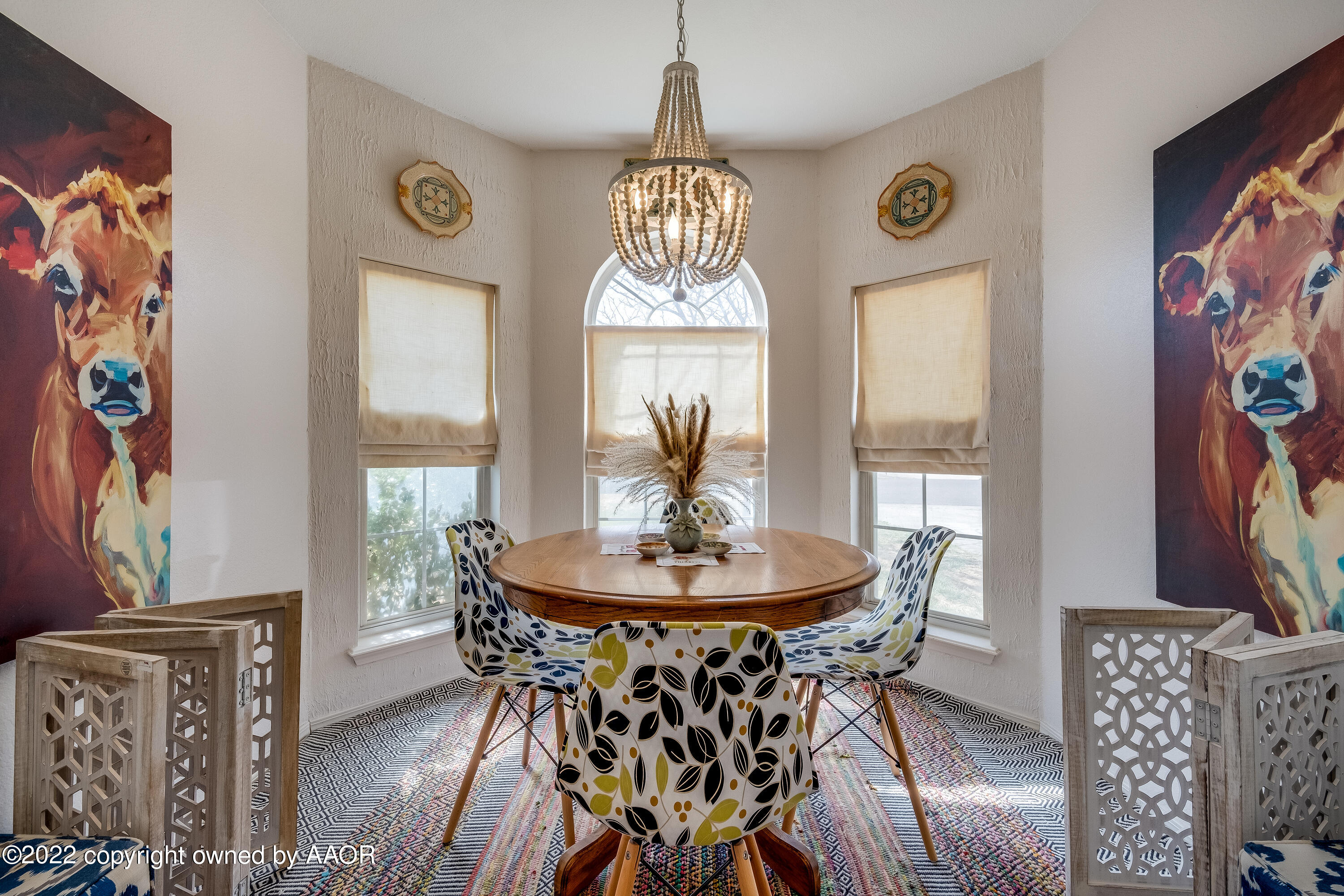 5001 Capulin Lane Amarillo, TX 79110 - Photo 8 of 22 a view of a dining room with furniture window and wooden floor