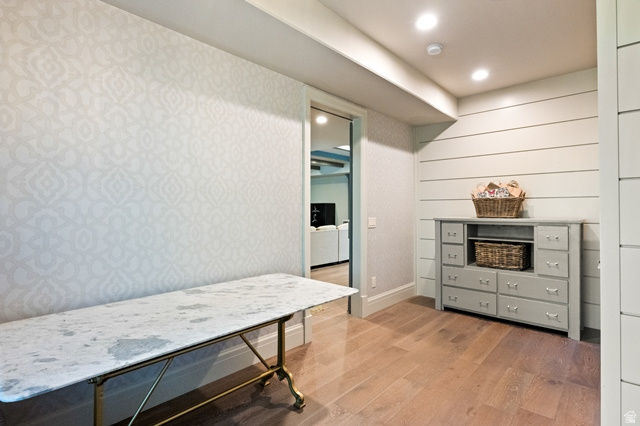 3 Carriagewood Cove, Unit 1088 Sandy, UT 84092 - Photo 49 of 79 Hardwood-style flooring with patterned accent wall and shiplap paneling