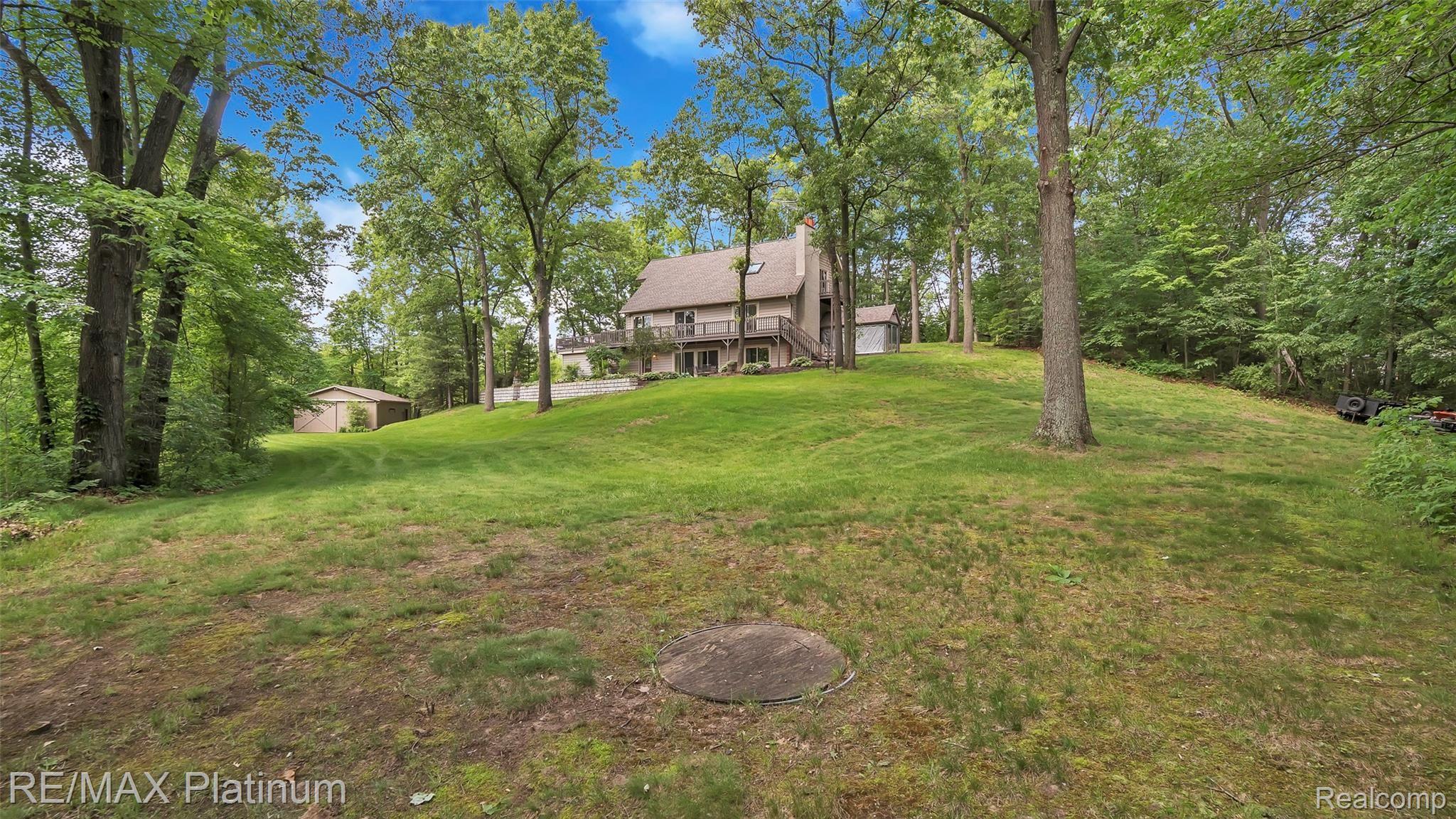 3196 Swarthout Road Pinckney, MI 48169 - Photo 34 of 44 Back Yard Firepit With Cover