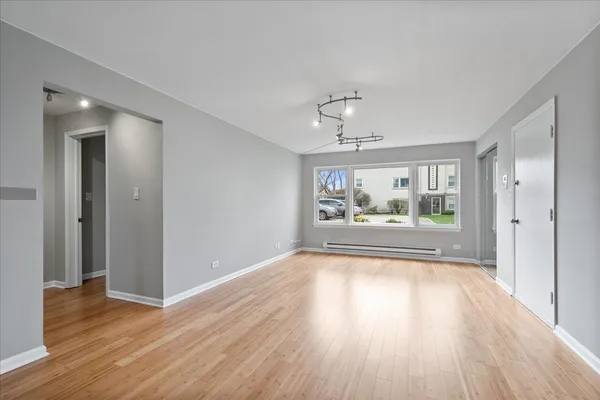 a view of livingroom with furniture wooden floor and window