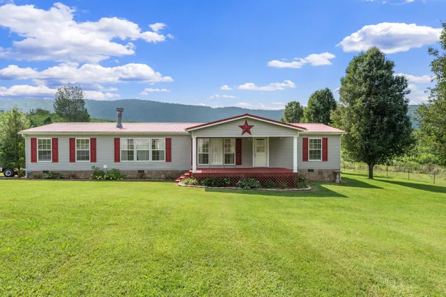 a view of a house with a big yard