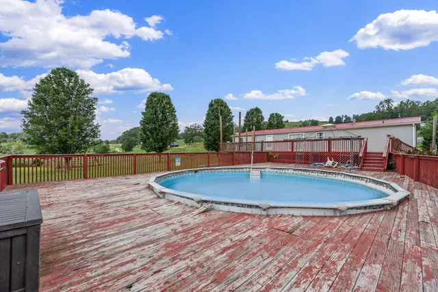 a view of swimming pool with a yard