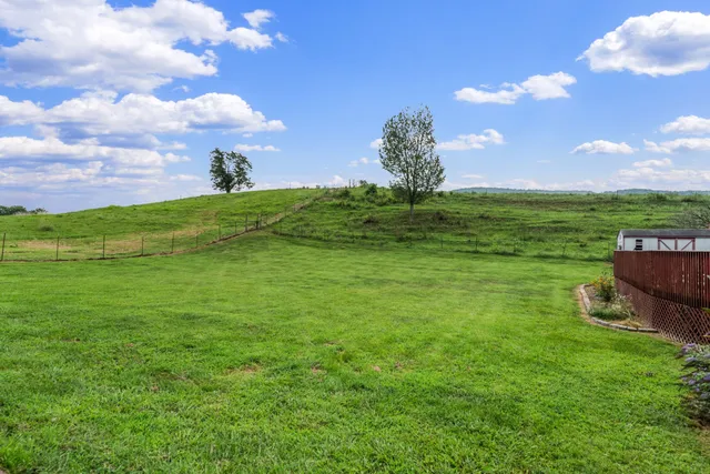 a view of a big yard with a house