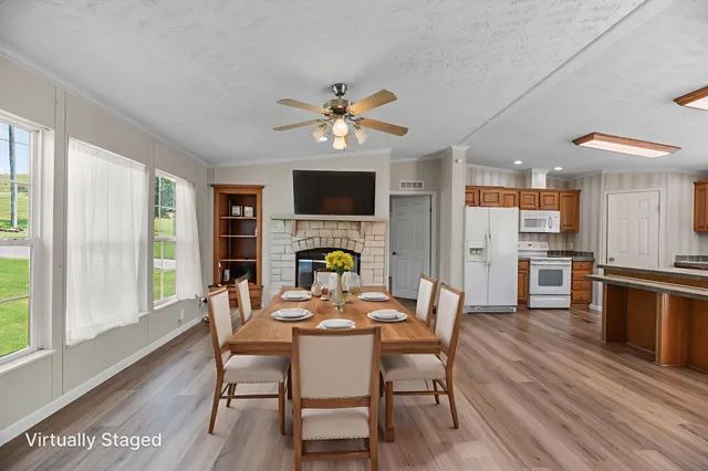 a view of a dining room with furniture window and wooden floor