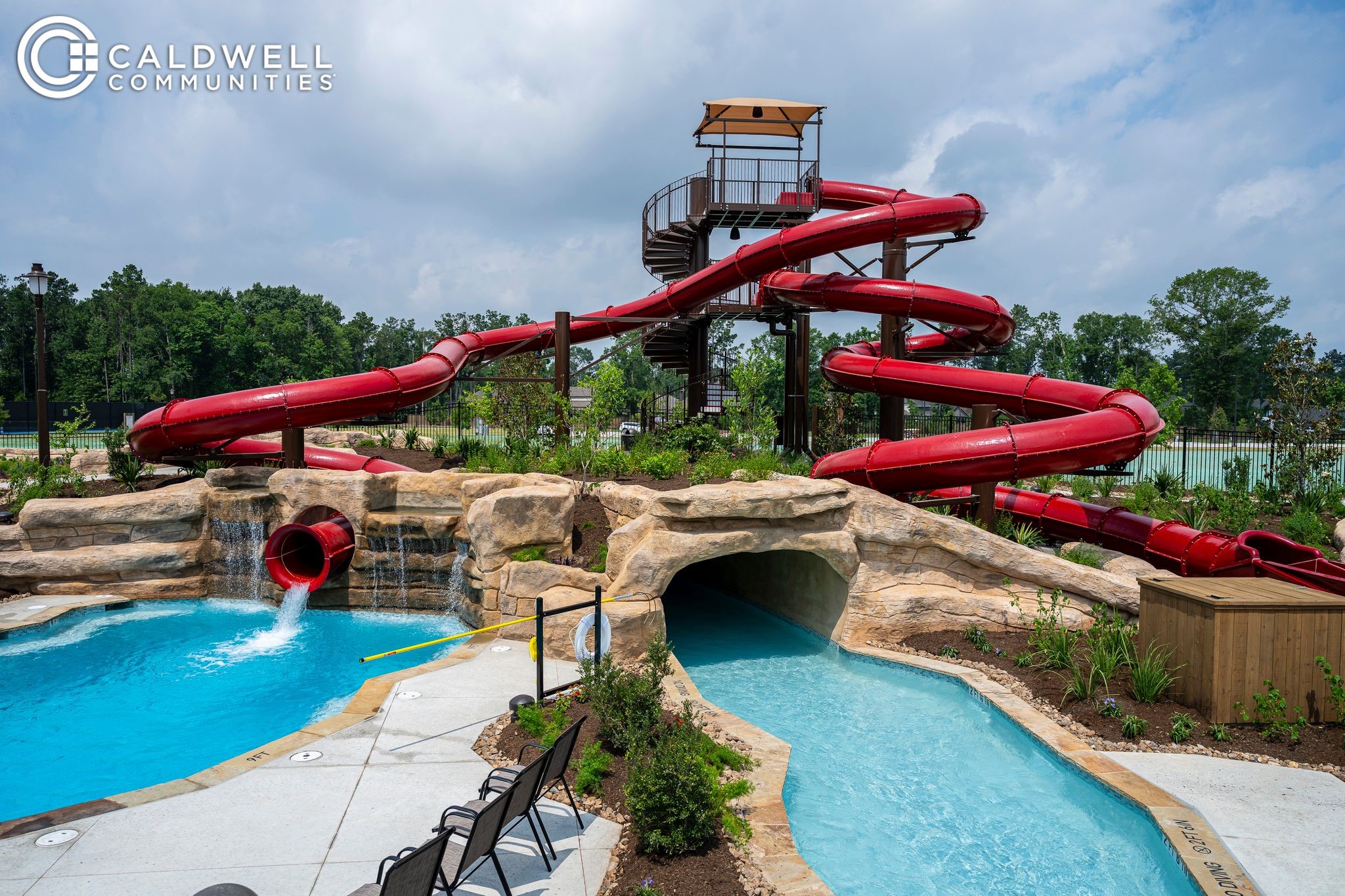 7602 Angels Lndg Lane Porter, TX 77365 - Photo 30 of 32 Amazing amenities in this community including this waterslide and lazy river as well as pickleball and tennis courts, lake, nature preserve with picnic area, pier, and a fire pit and hiking trails, jogging paths, parks and playgrounds, and an onsite brand new elementary school!