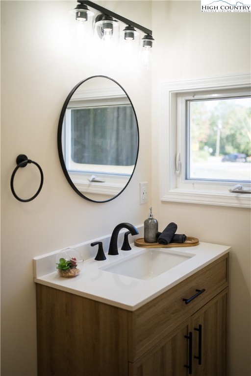 90 Camp Branch Road Waynesville, NC 28786 - Photo 15 of 34 a bathroom with a sink and a mirror