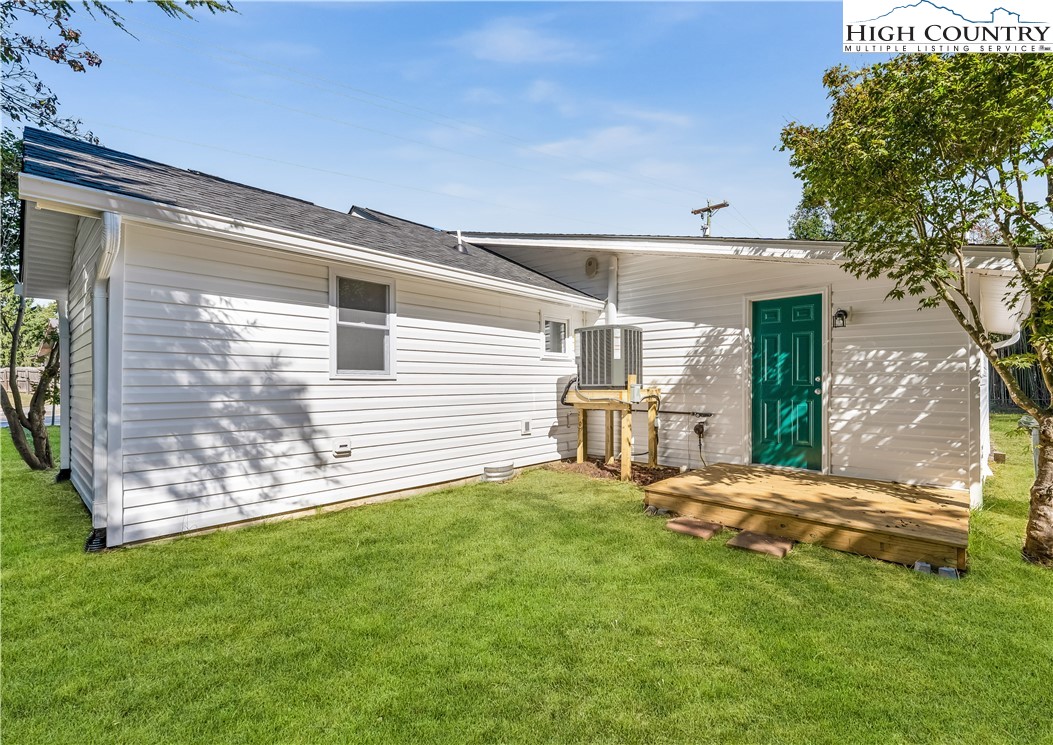 90 Camp Branch Road Waynesville, NC 28786 - Photo 30 of 34 a view of a backyard with table and chairs and garden
