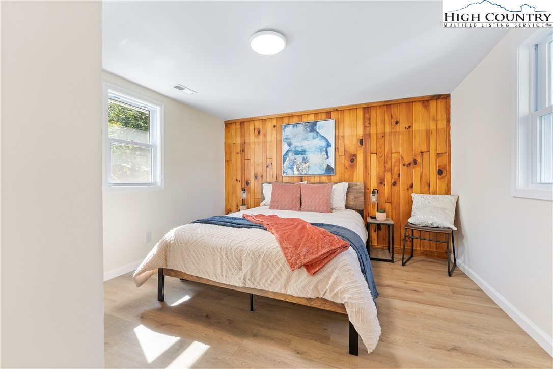 90 Camp Branch Road Waynesville, NC 28786 - Photo 6 of 34 a bed sitting in a bedroom next to a window