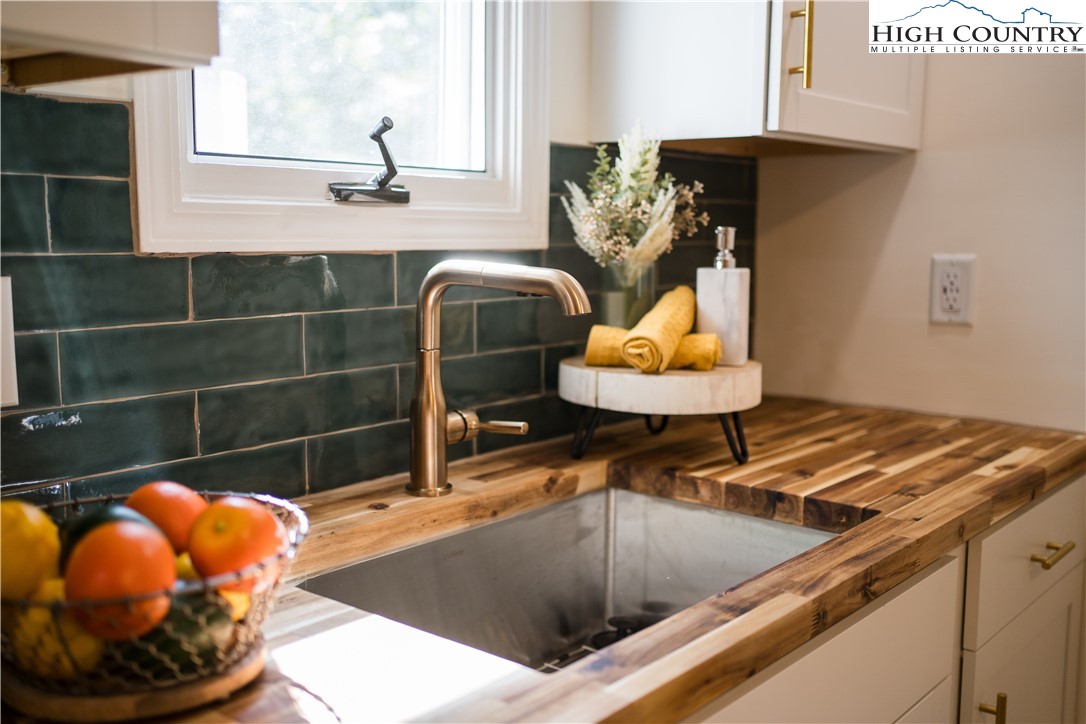 90 Camp Branch Road Waynesville, NC 28786 - Photo 8 of 34 a bathroom with a sink and a mirror